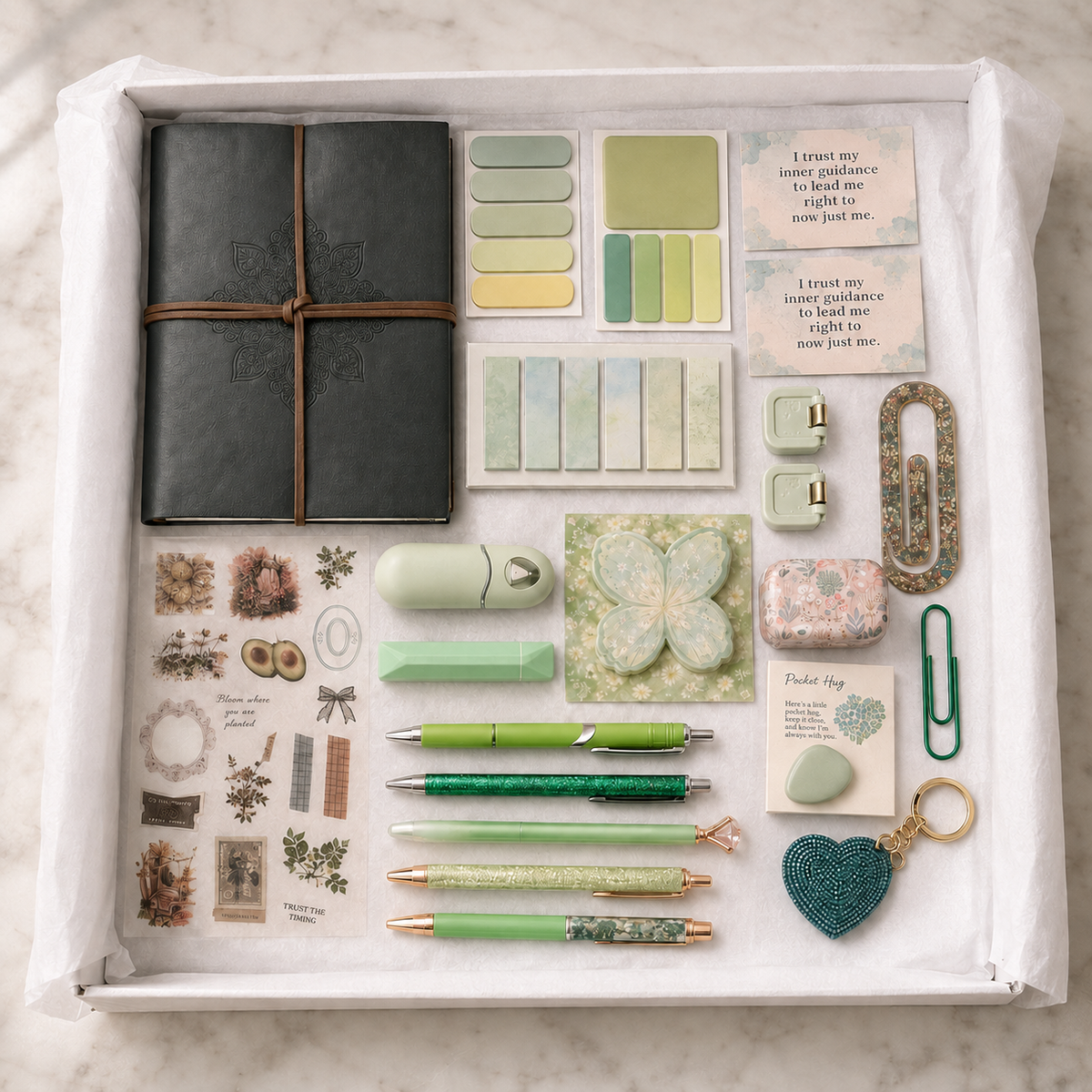 Sage Green Journal Gift Box contents displayed in white box including journal, pens, stickers, keychains and accessories