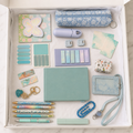 Aqua stationery gift box in white box showing aqua A5 hardcover notebook, blue floral pencil pouch, five decorative pens, marble bookmarks, page marker sets, butterfly sticky notes, encouragement cards, correction tape, resin paperclip, rhinestone keychain, cactus accessory case, pale-blue ID holder, crossbody strap and badge reel