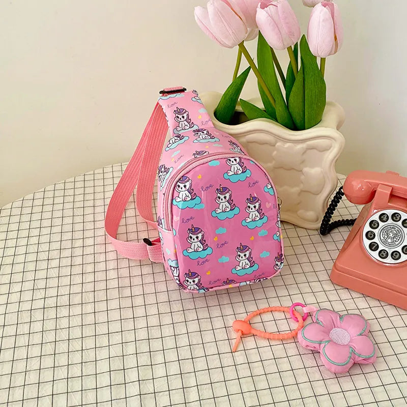 Pink dinosaur print crossbody bag with flower charm accessory