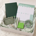 Mint and sage green stationery gift box in white box with sage tissue paper showing dark green notebook, mint weekly planner, crystal pens, green sticky notes, clip organizer, sage badge holder and rhinestone keychain