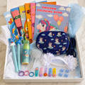 Blue magical unicorn activity gift box contents in white box including crossbody bag, coloring books, pens, hairbrush and hair accessories