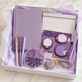 Pastel lavender stationery gift box in white box with lavender tissue paper showing notebook, weekly planner, cat memo notes, pens, clip organizer and rhinestone keychain