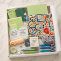 Green nurse-themed fabric pouch gift box with coordinating green journal and accessories
